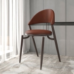 Picture of Dining Chair Upholstered Leather in Iron With an Open Curved Back Design